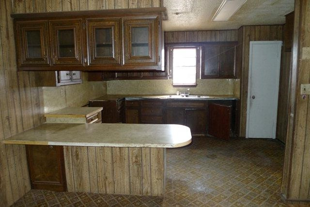 513 East Tulane Street Lubbock, TX 79403 - Photo 3 of 10 a kitchen with a sink and cabinets