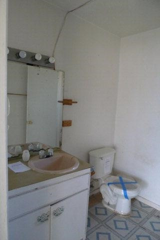 513 East Tulane Street Lubbock, TX 79403 - Photo 4 of 10 a bathroom with a sink and a toilet