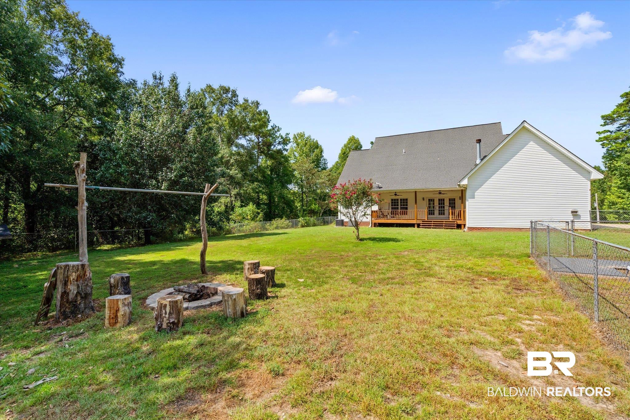 72 Limestone Drive Jackson, AL 36545 - Photo 29 of 38 View of yard with a wooden deck and an outdoor fire pit
