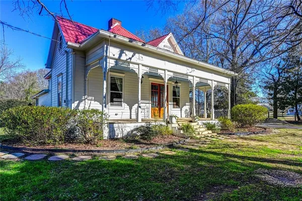 a front view of a house with garden