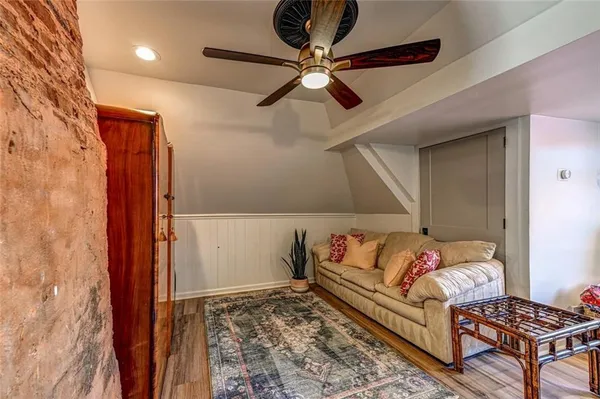 a bedroom with furniture and a rug