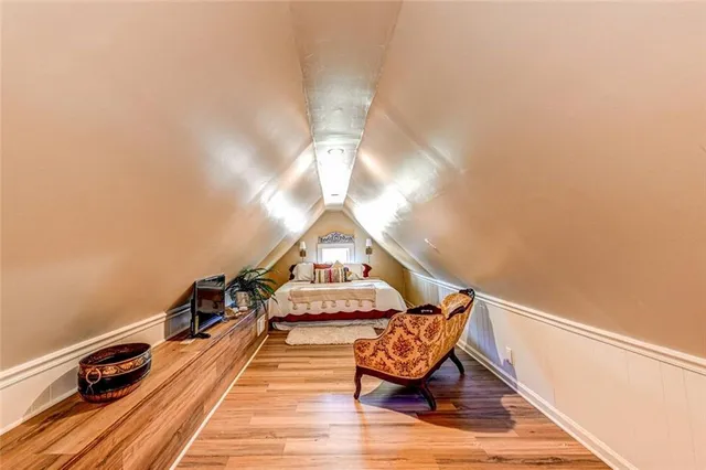 a balcony with wooden benches and couch