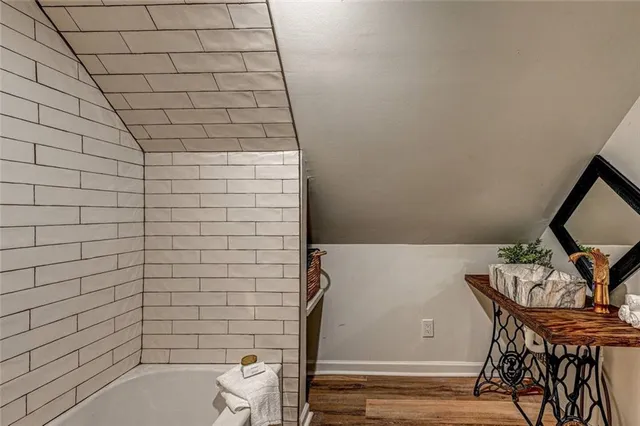 a bathroom with a bathtub and toilet