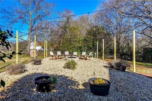 a view of a backyard with sitting area
