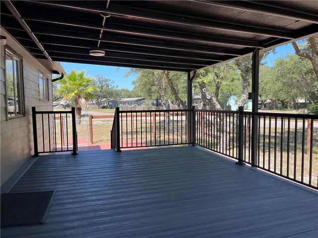 a view of porch with wooden floor in outdoor space