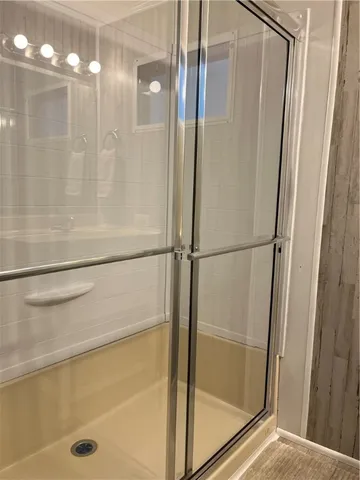 a living room with furniture and a lamp