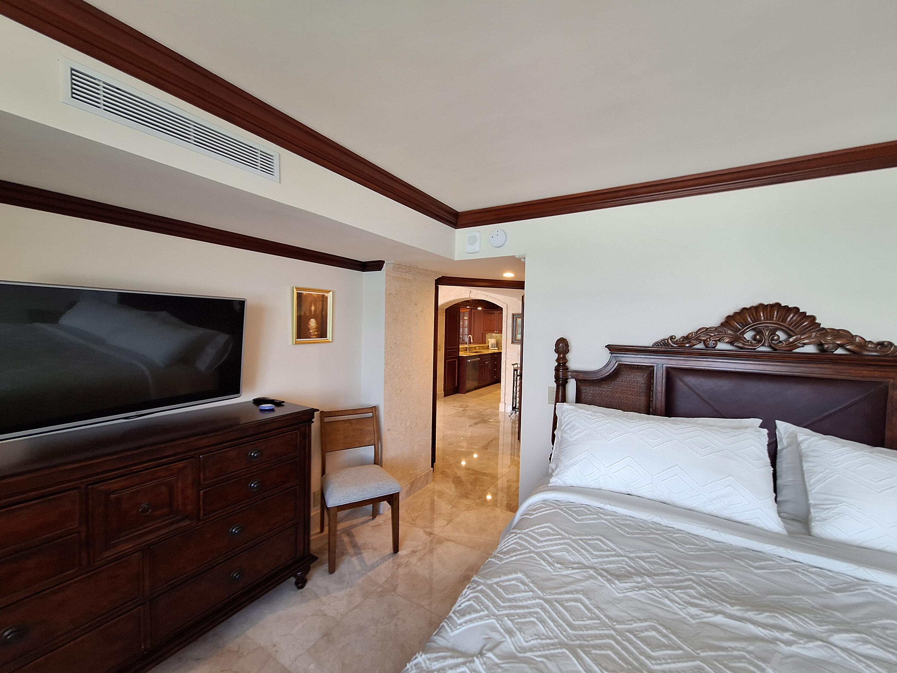 3400 North Ocean Drive, Unit PH2 Singer Island, FL 33404 - Photo 18 of 38 a living room with furniture and a flat screen tv