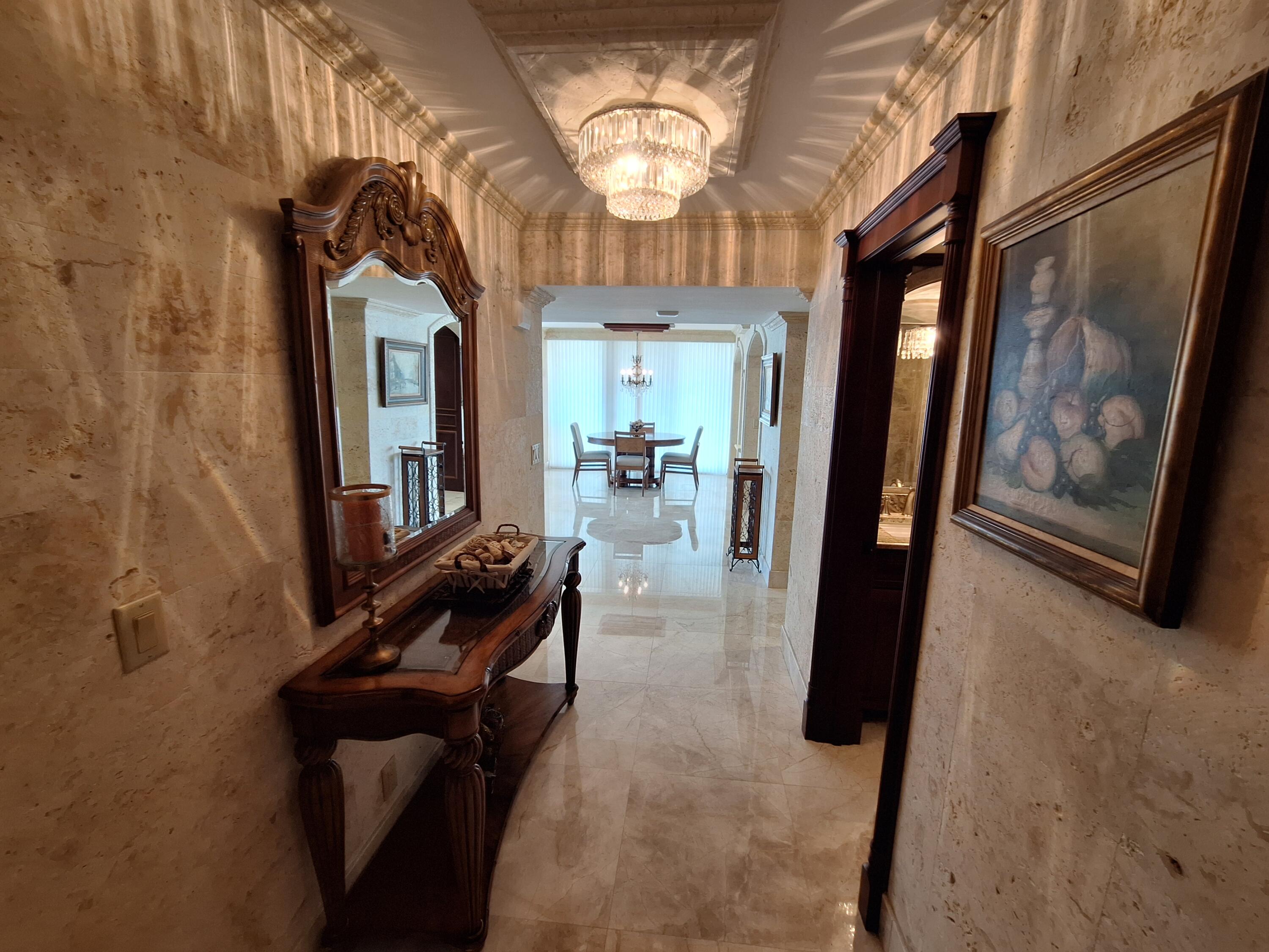 3400 North Ocean Drive, Unit PH2 Singer Island, FL 33404 - Photo 2 of 38 a view of living room with furniture and a window