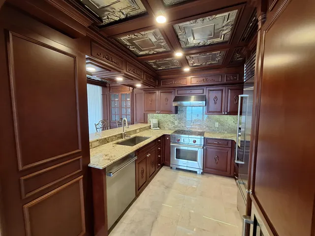 a dining room with furniture and a chandelier