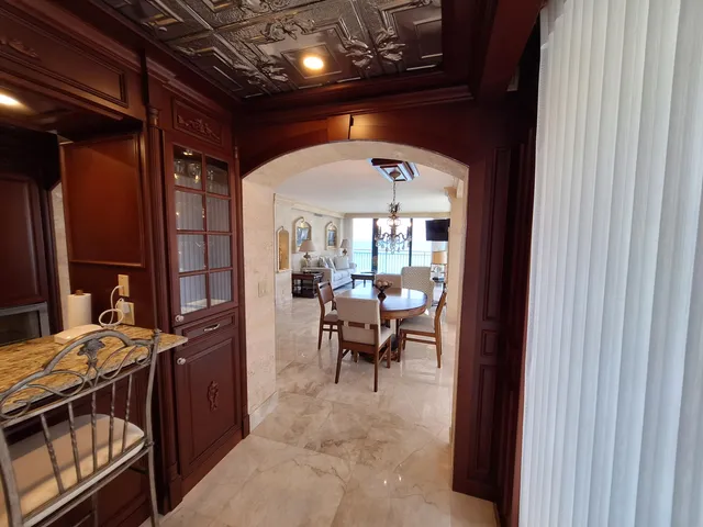 a living room with furniture and large window