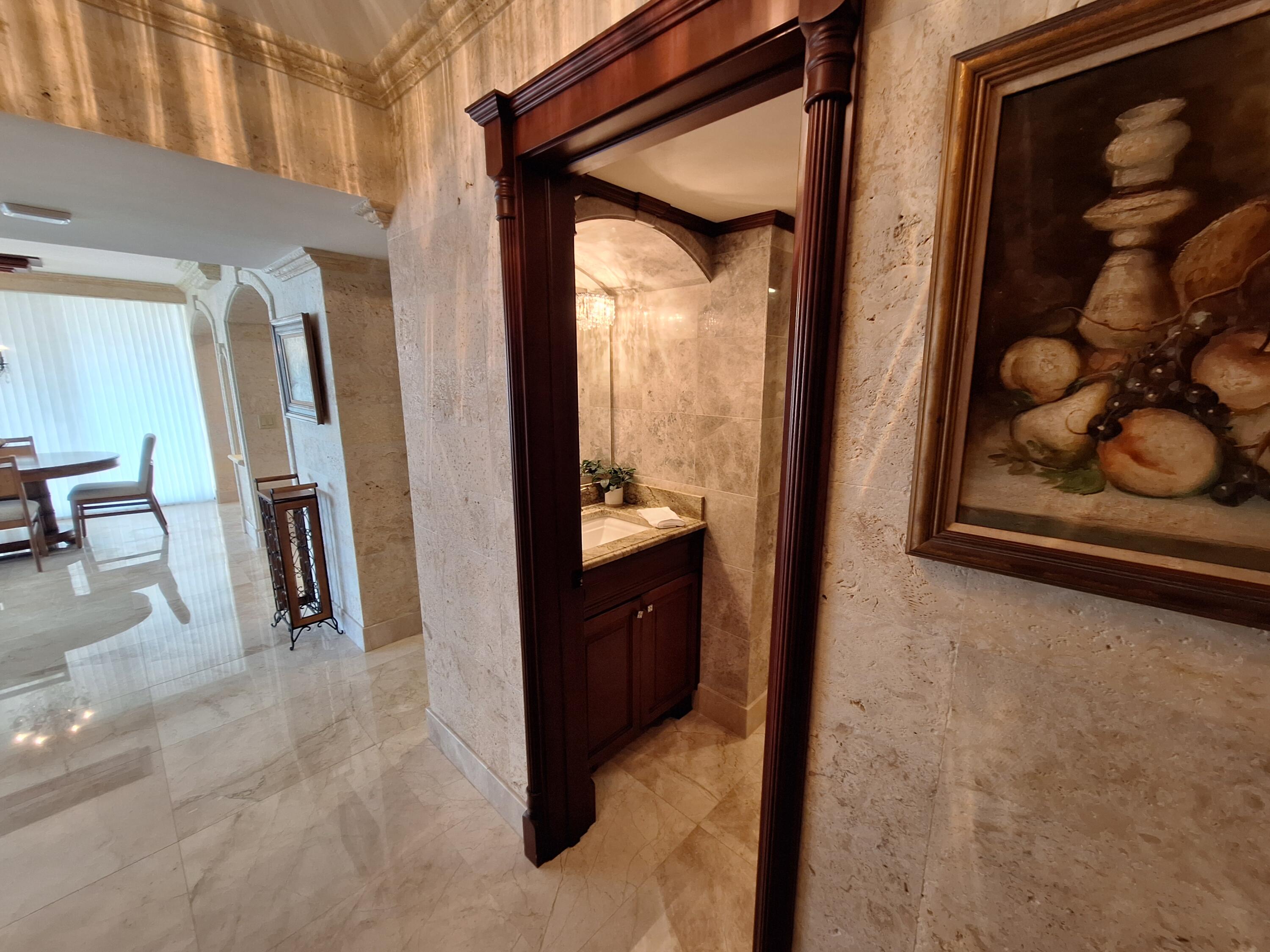 3400 North Ocean Drive, Unit PH2 Singer Island, FL 33404 - Photo 3 of 38 a view of a hallway and two windows