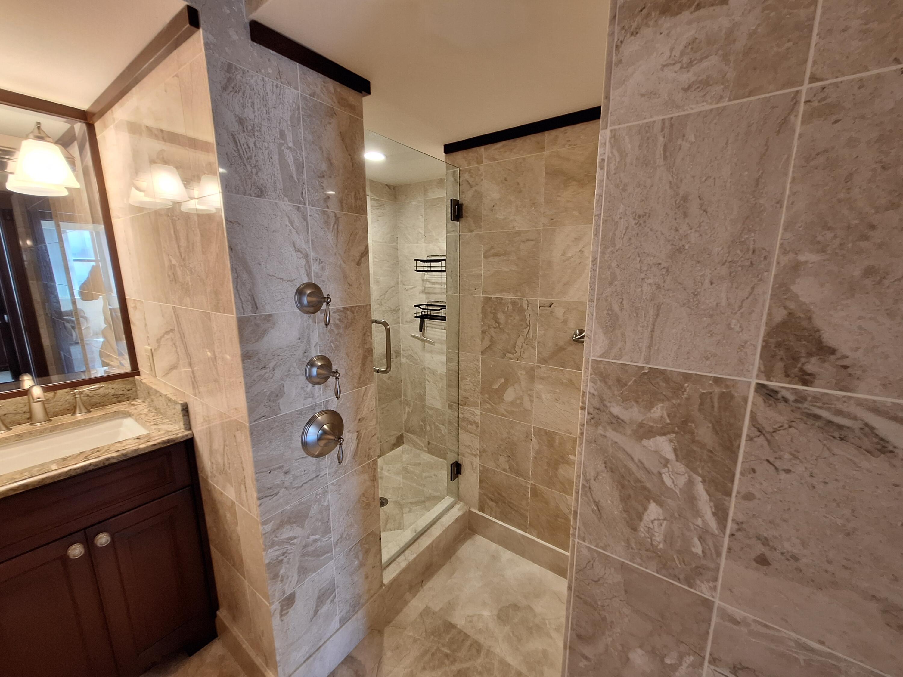 3400 North Ocean Drive, Unit PH2 Singer Island, FL 33404 - Photo 31 of 38 a bathroom with a shower and a sink