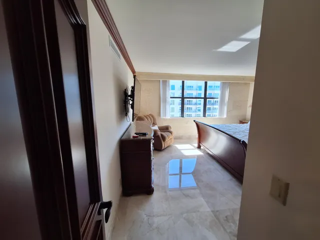 a view of table tennis room with a window