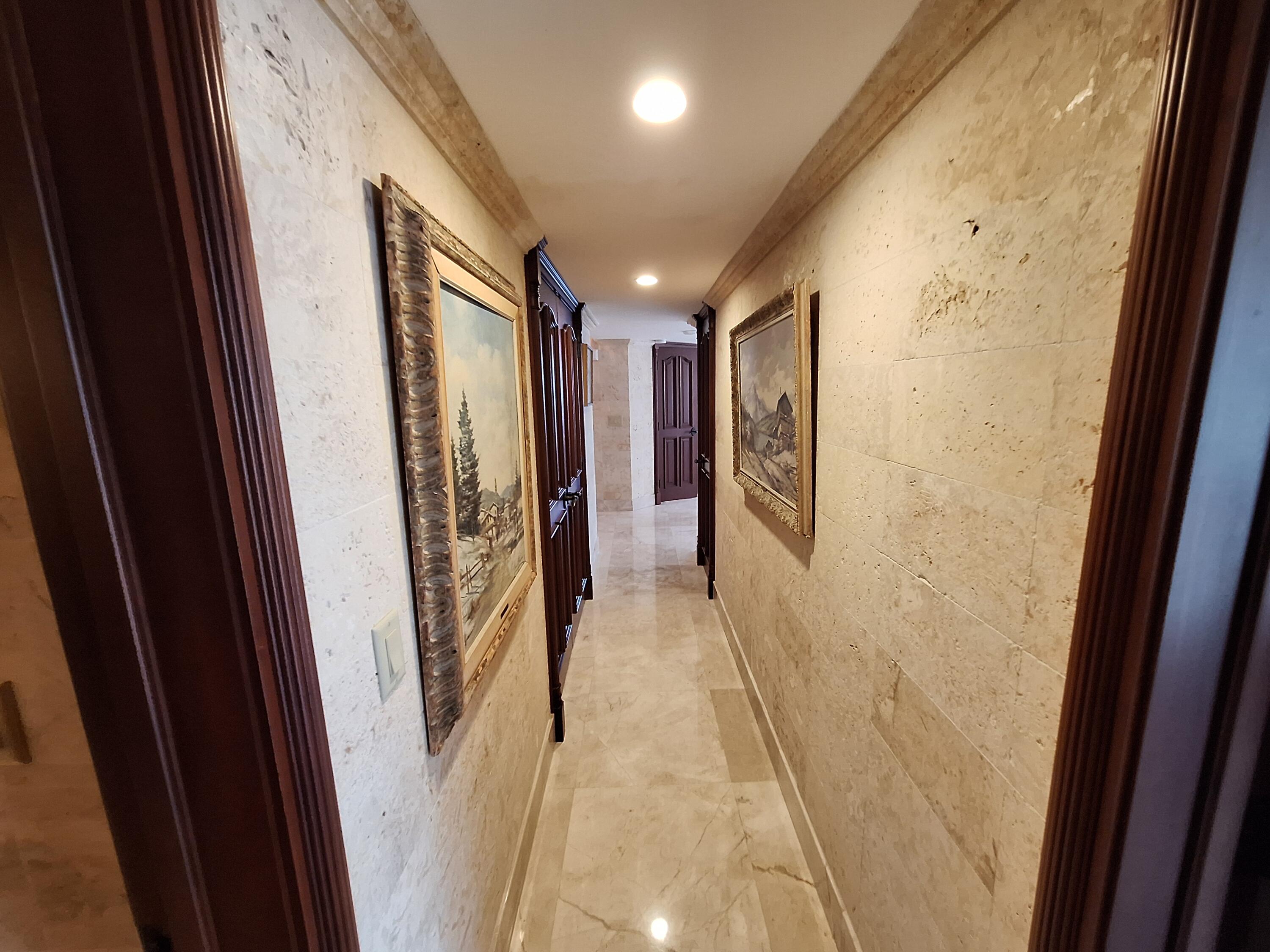 3400 North Ocean Drive, Unit PH2 Singer Island, FL 33404 - Photo 36 of 38 a view of hallway with stairs