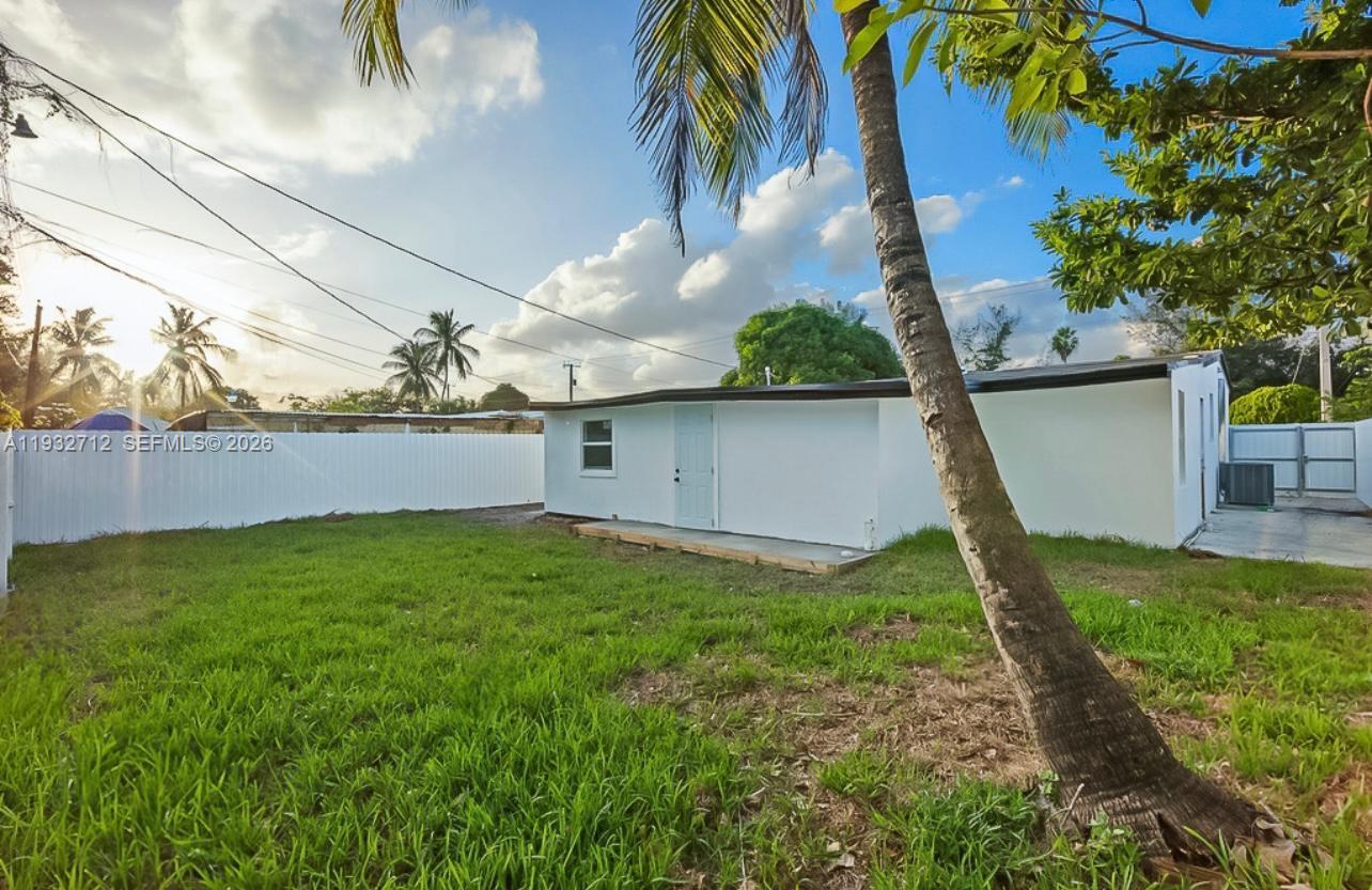 724 Burlington Street Opa-Locka, FL 33054 - Photo 15 of 15 a backyard of a house with lots of green space