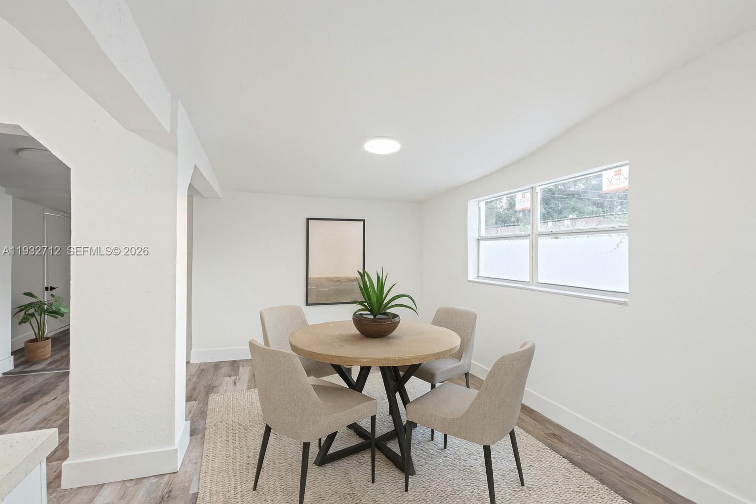 724 Burlington Street Opa-Locka, FL 33054 - Photo 4 of 15 a dining room with furniture and window