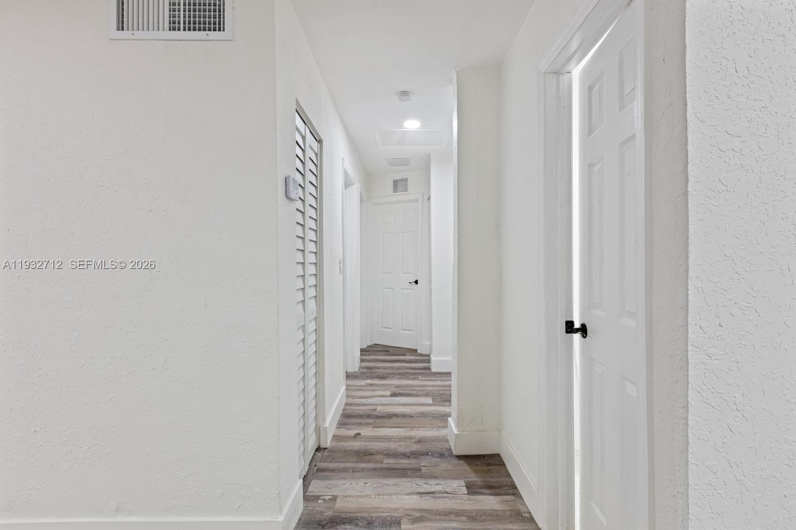 724 Burlington Street Opa-Locka, FL 33054 - Photo 5 of 15 a view of a hallway with stairs