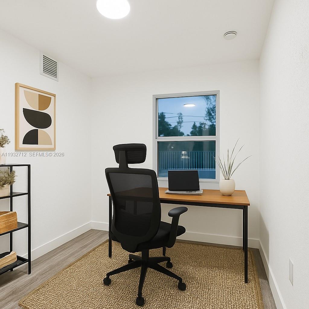 724 Burlington Street Opa-Locka, FL 33054 - Photo 6 of 15 a view of a workspace with furniture