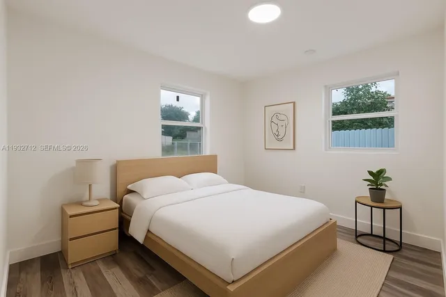 a bedroom with a bed and window