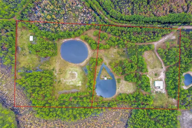 an aerial view of a house with a yard and a garden