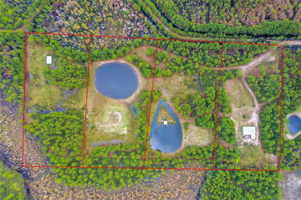 265 Carter Trail Ormond Beach, FL 32174 - Photo 8 of 8 an aerial view of a house with a yard and a garden