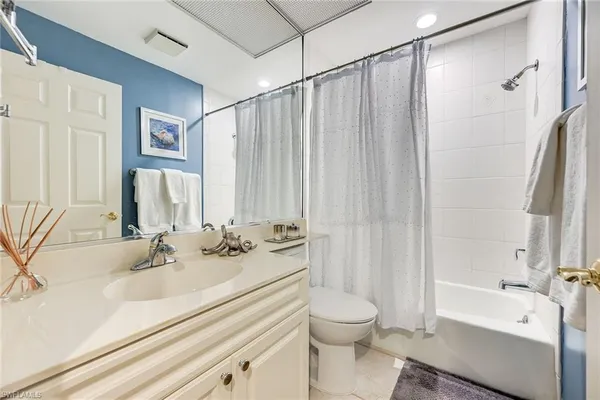 a bathroom with a sink a toilet and a bathtub