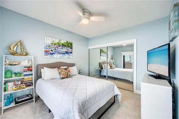 a bedroom with a bed and a couch