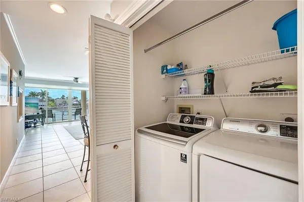 a kitchen with a stove and a white refrigerator