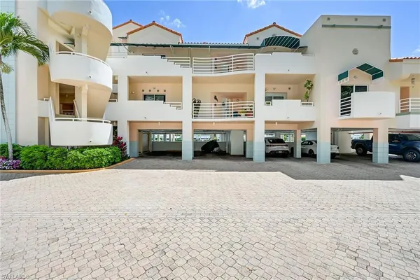 a front view of a building with parking space