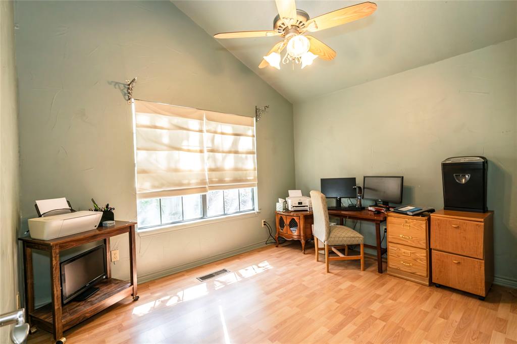 698 Storey Road Nocona, TX 76255 - Photo 20 of 34 Office space with lofted ceiling, light wood-style floors, and a ceiling fan