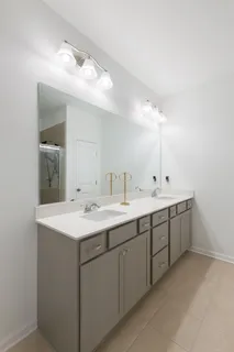 a view with a sink and mirror with window