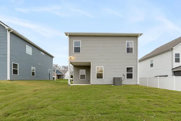 a view of a house with a backyard
