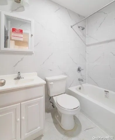 a bathroom with a sink toilet and bathtub