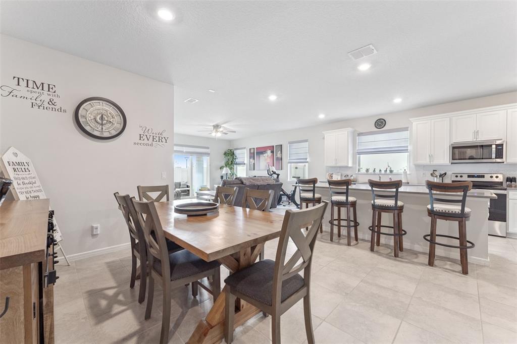 1989 Spring Shower Circle Kissimmee, FL 34744 - Photo 13 of 63 a view of a dining area with furniture