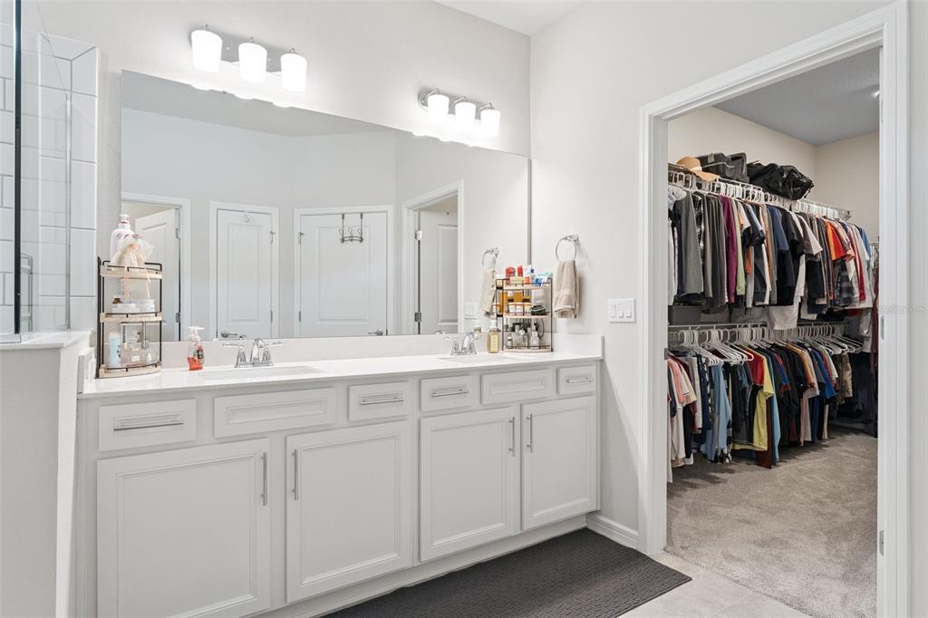 1989 Spring Shower Circle Kissimmee, FL 34744 - Photo 26 of 63 a view of walk in closet with clothes and shoes