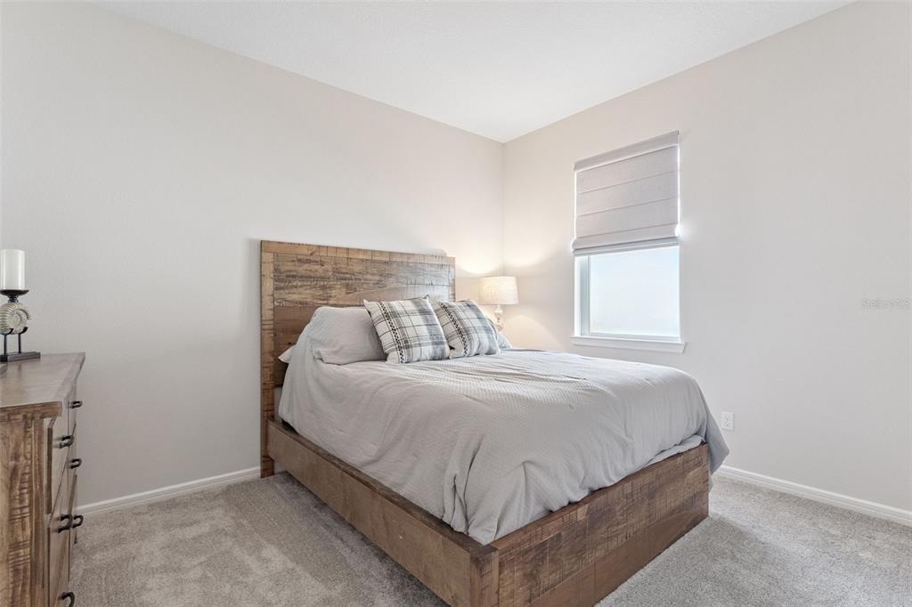 1989 Spring Shower Circle Kissimmee, FL 34744 - Photo 29 of 63 a bedroom with a bed and window