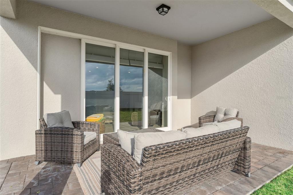 1989 Spring Shower Circle Kissimmee, FL 34744 - Photo 33 of 63 a living room with furniture and a large window