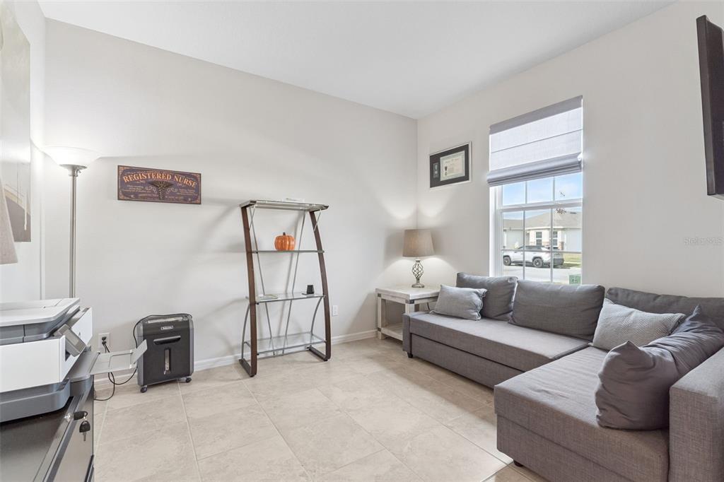 1989 Spring Shower Circle Kissimmee, FL 34744 - Photo 7 of 63 a living room with furniture and a window
