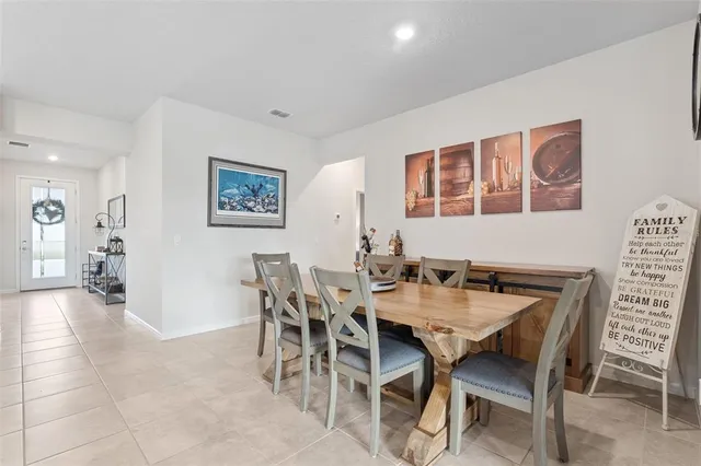 a view of a dining room with furniture and a table
