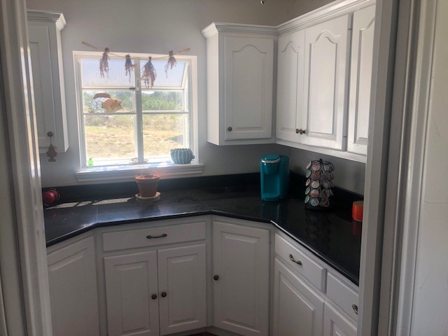 251 East Ranch Road 2169 Junction, TX 76849 - Photo 14 of 43 a kitchen with a sink and cabinets