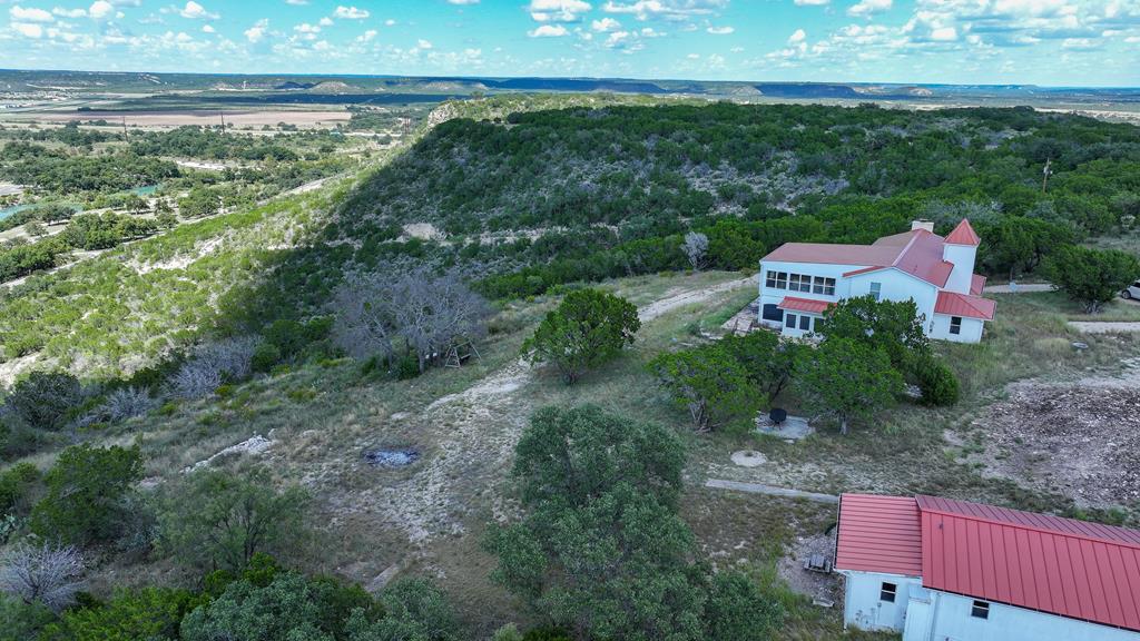 251 East Ranch Road 2169 Junction, TX 76849 - Photo 6 of 43 a backyard of a house with lots of green space
