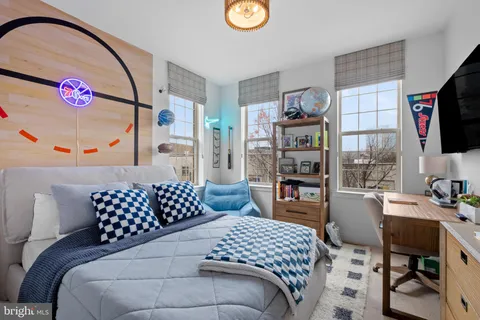 a bedroom with a bed and a table