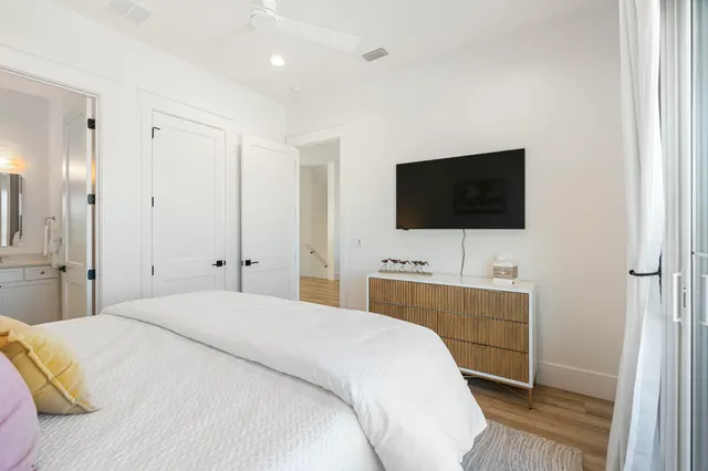 a bathroom with a sink mirror toilet and shower