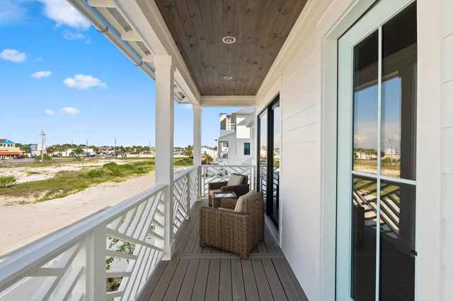a view of swimming pool with outdoor seating