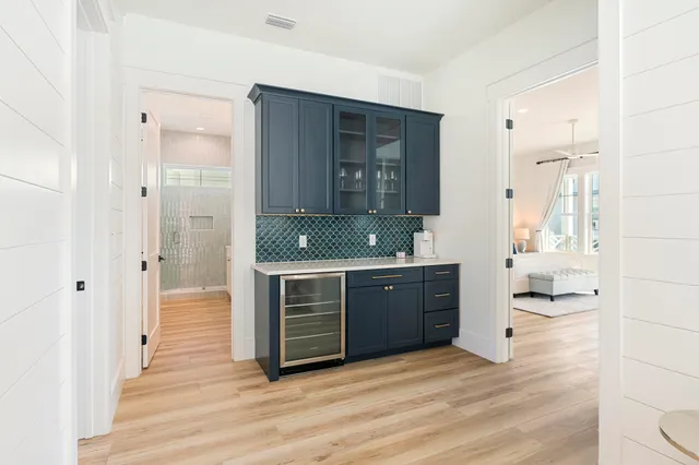 a view of wooden floor and windows in a room