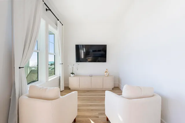 a bathroom with double vanity sinks and a bathtub