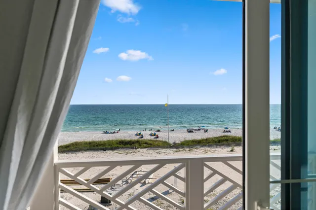 an aerial view of a house with a ocean view