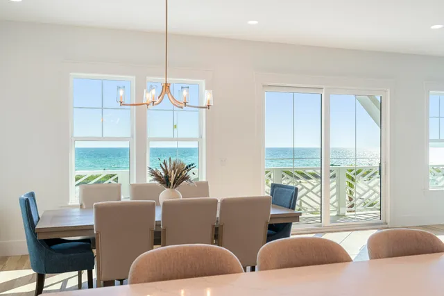 a large kitchen with a table and chairs