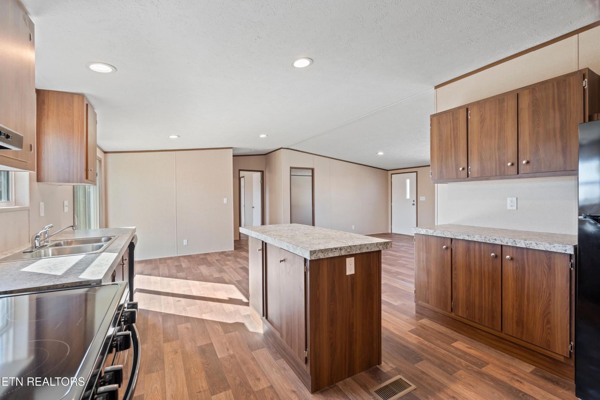 911 Summer Street Loudon, TN 37774 - Photo 11 of 25 a kitchen with a sink stove and cabinets