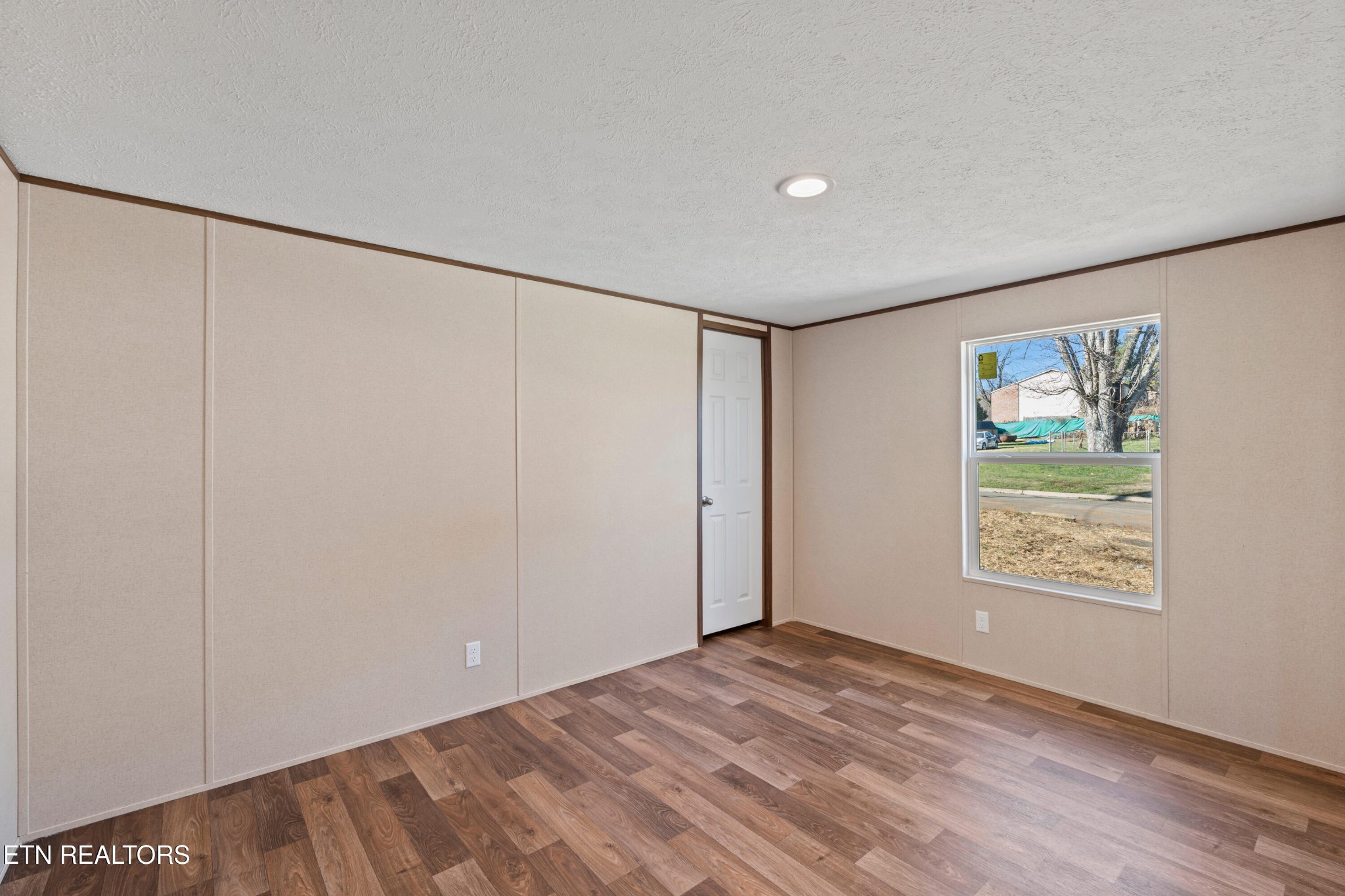 911 Summer Street Loudon, TN 37774 - Photo 20 of 25 a view of an empty room with a window
